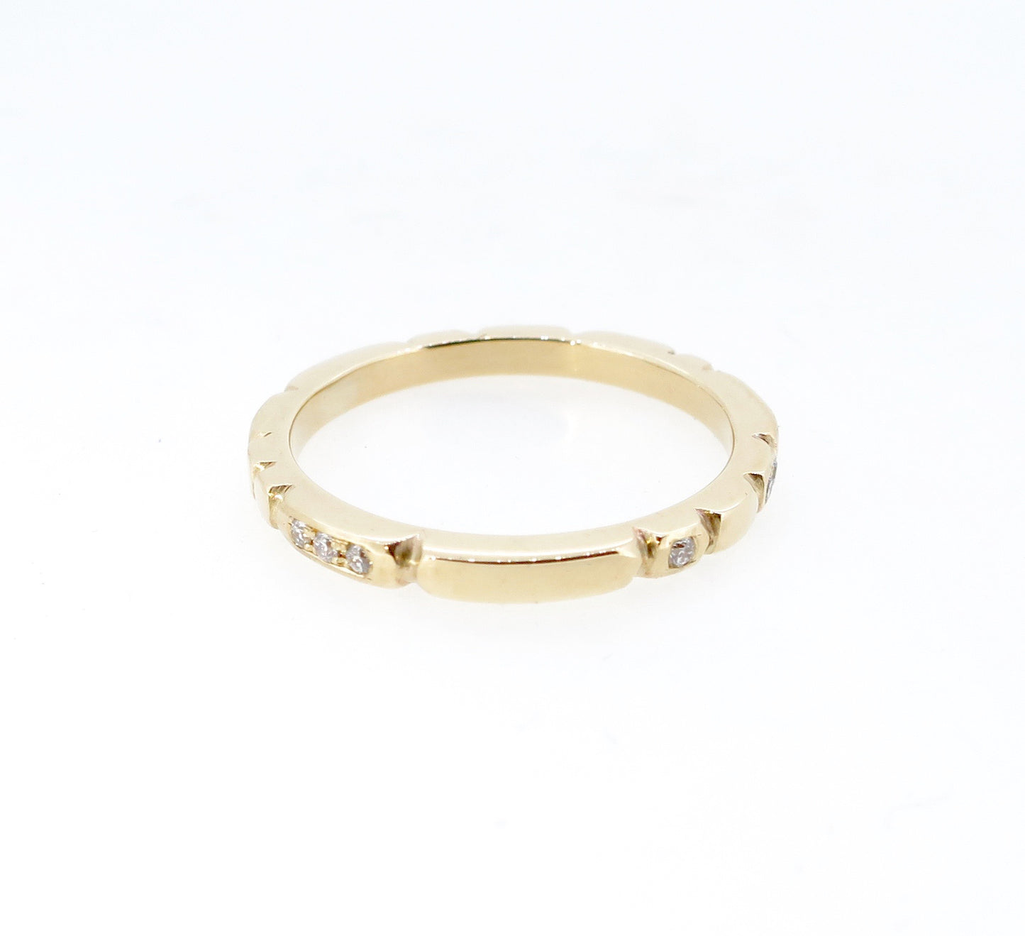 Sculpt gold band with diamonds