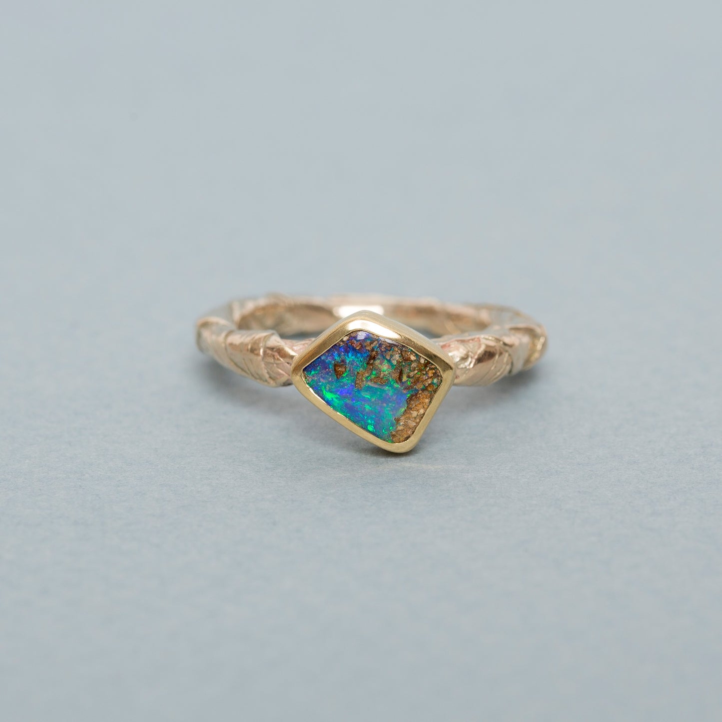 Woven ring with opal