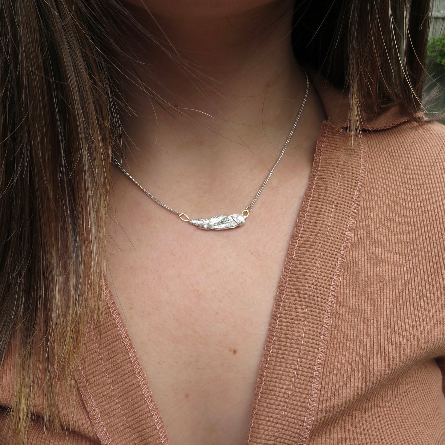Woven pendant with aqua diamonds