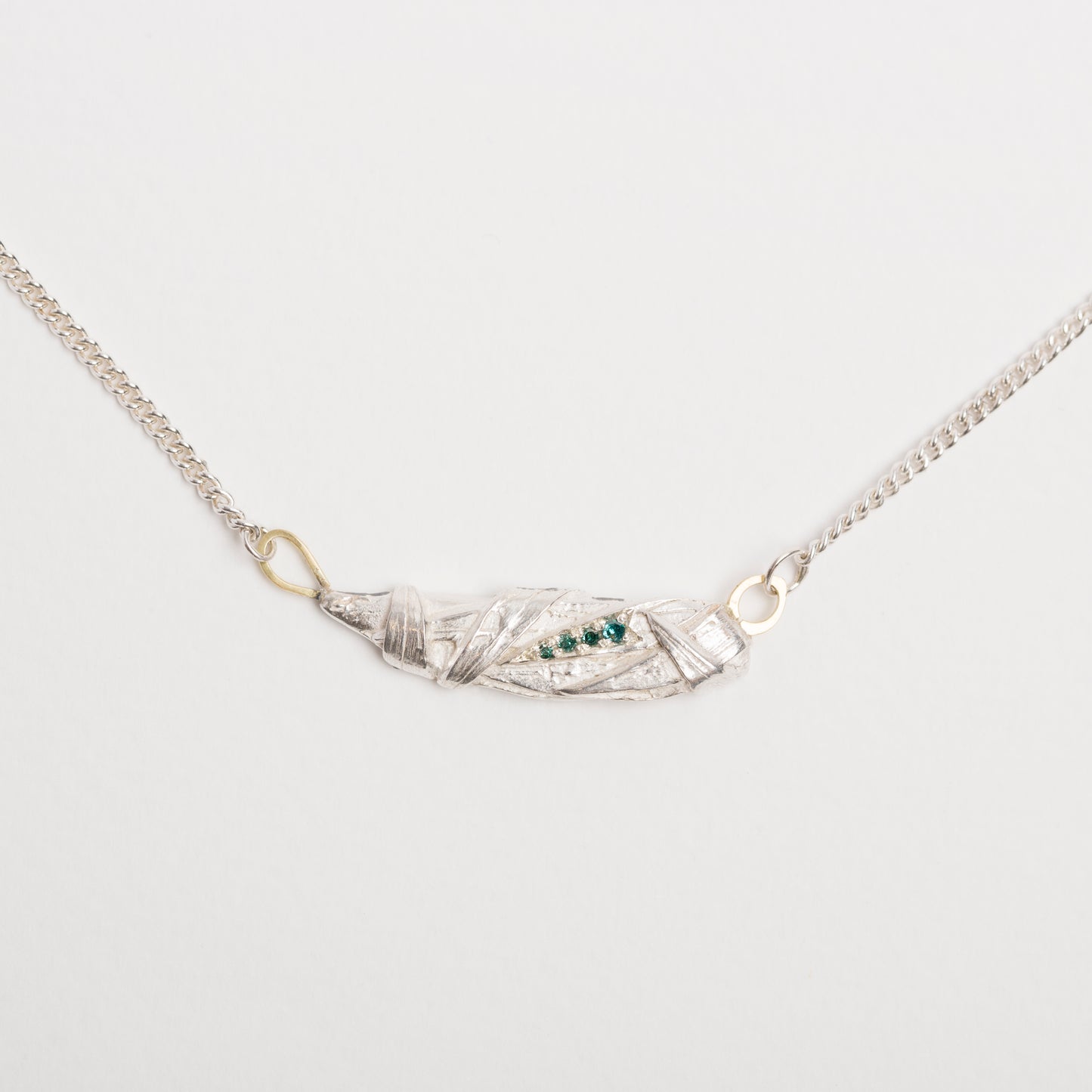 Woven pendant with aqua diamonds